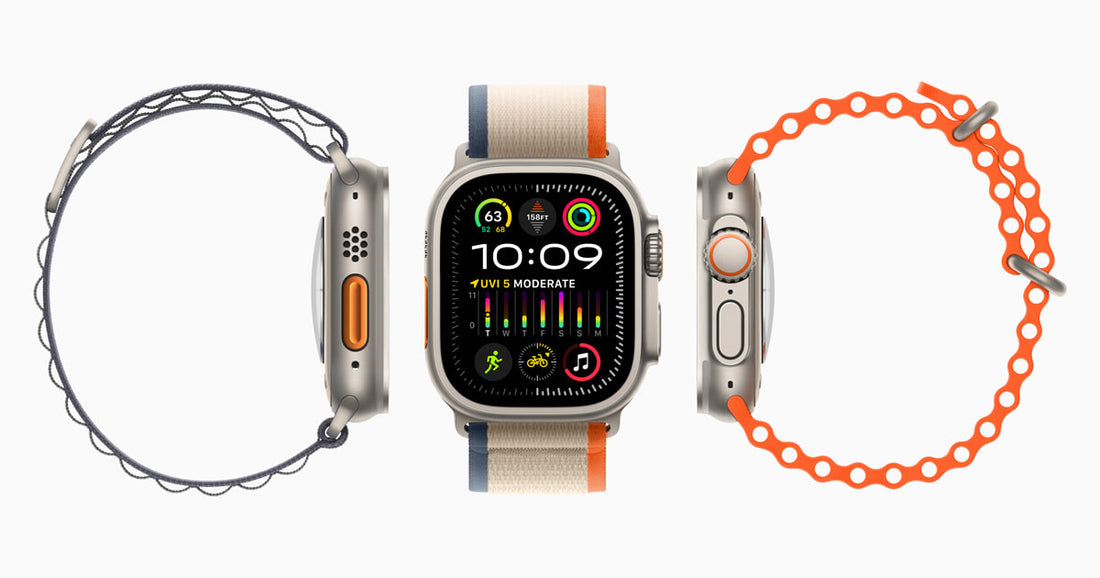Tres Apple Watch Ultra 2 con bandas naranja, dos de perfil y uno de frente